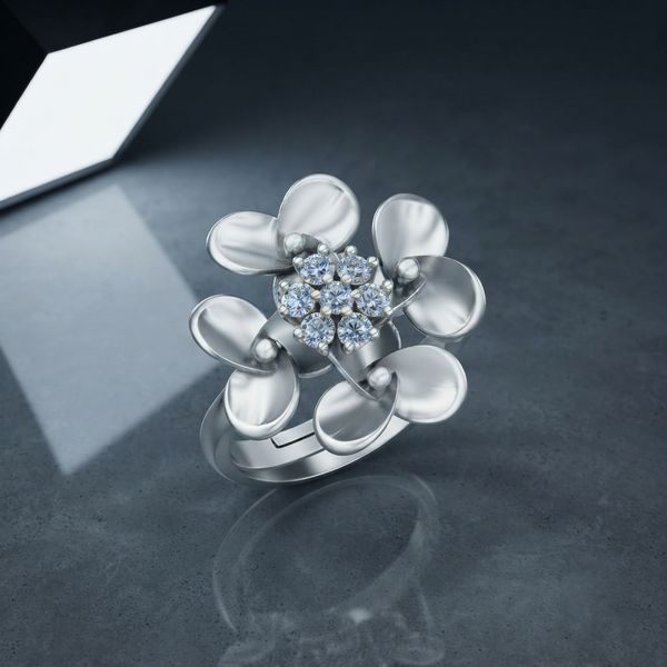 A 925 silver flower-shaped ring with a cluster of clear Diamonds in the center, displayed on a dark gray reflective surface.